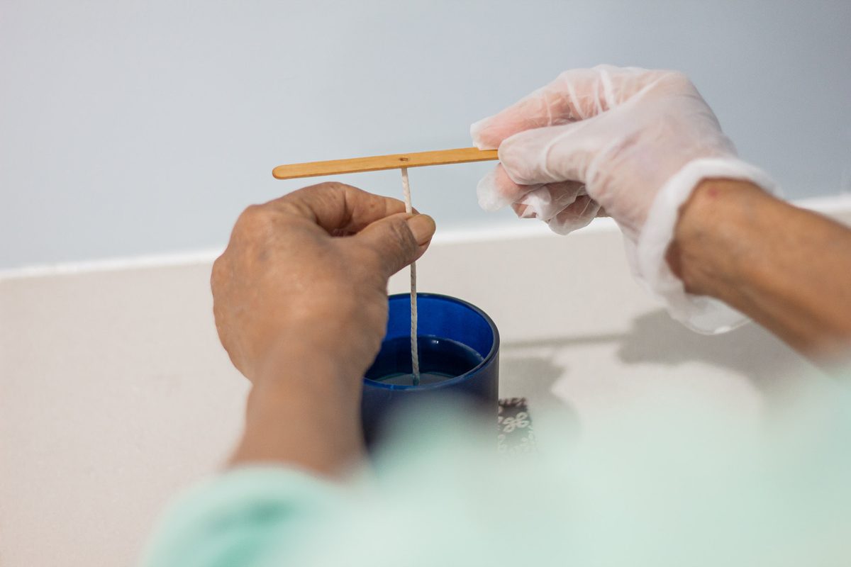 Held in place while the wax sets